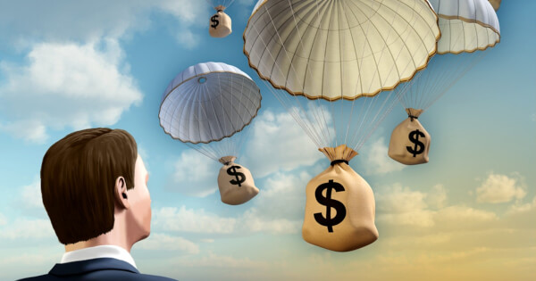 Concept of cryptocurrencies being airdropped from parachute