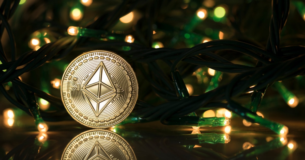 Symbol of Ethereum coin below a Christmas tree