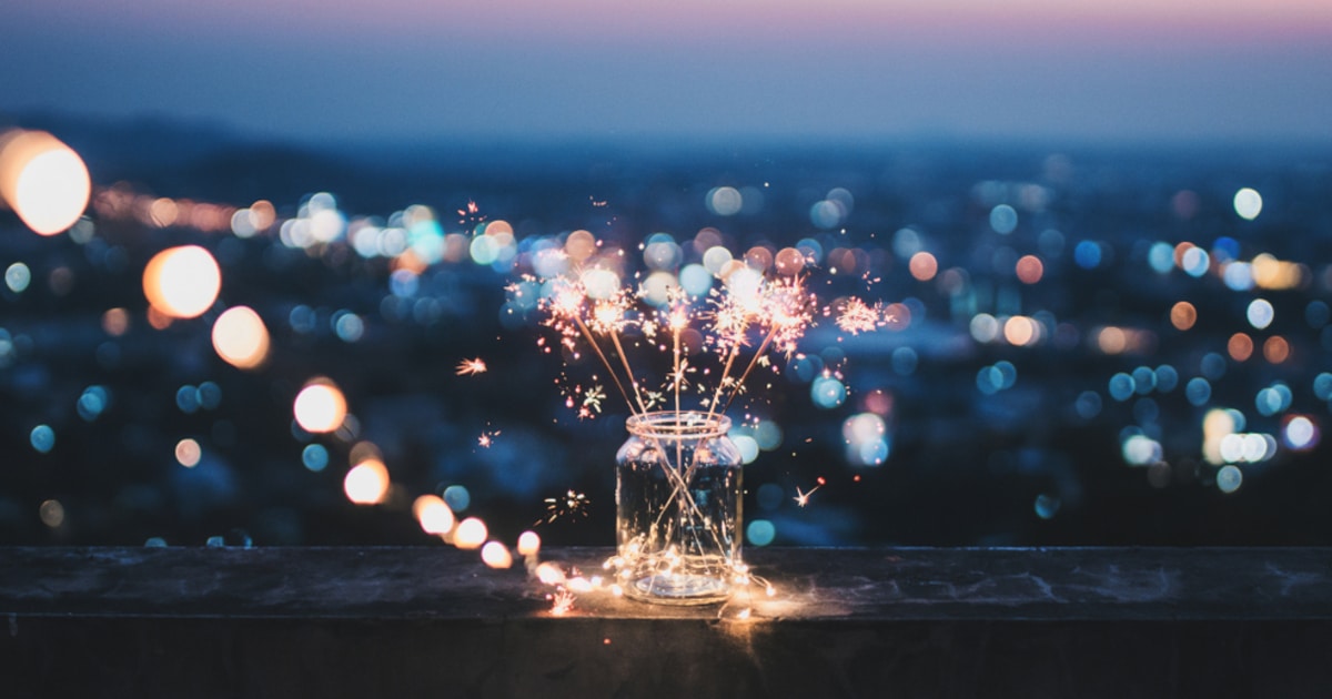 Sparklers in a bottle sitting on a ledge representing spark token airdrop