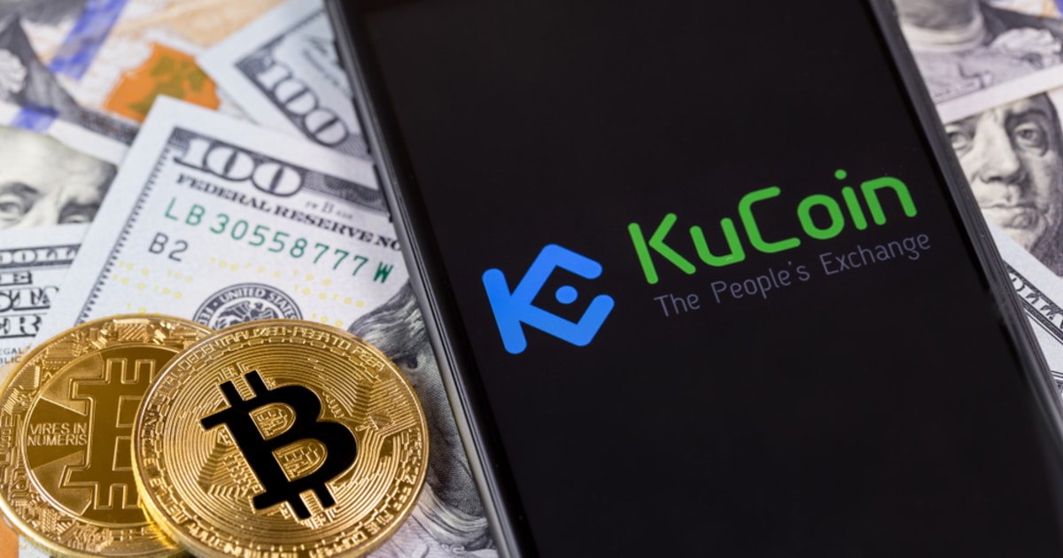 KuCoin platform assessed through a smartphone amid USD and Bitcoin