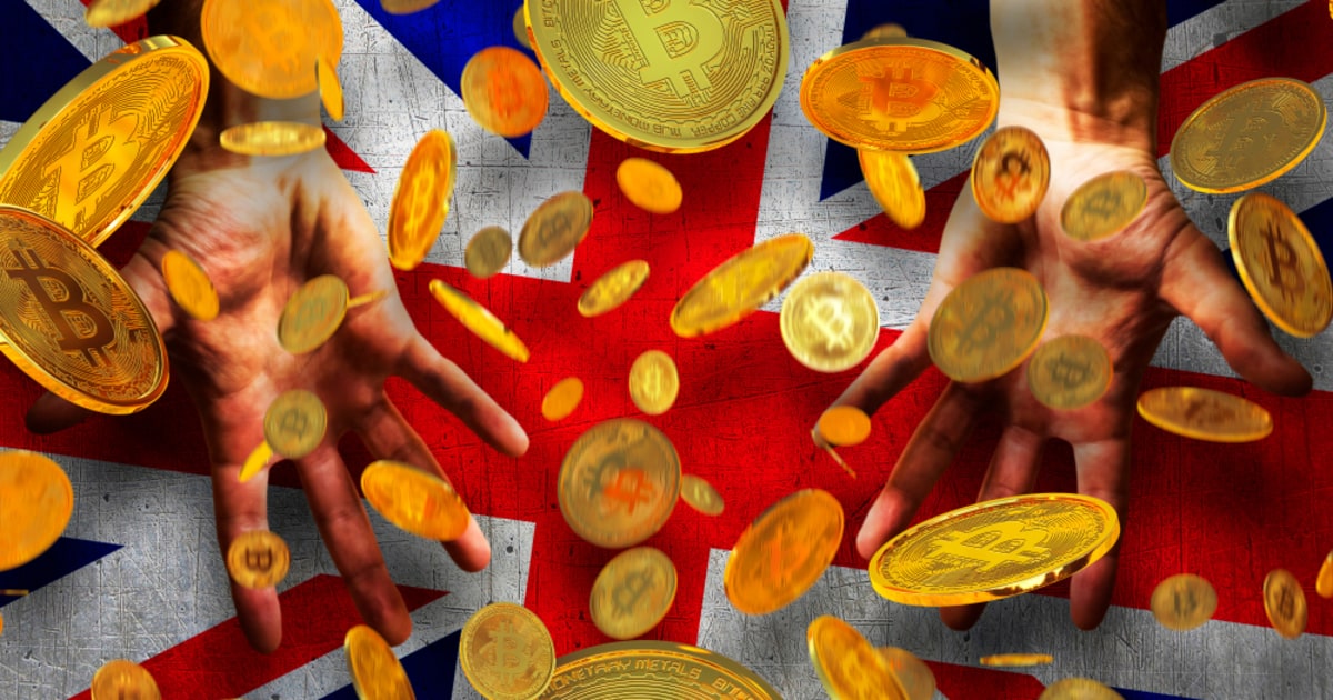 hand outstretched to receive Bitcoin on UK flag background